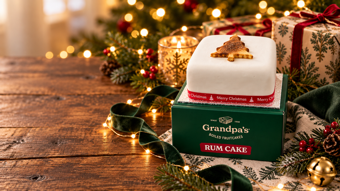 4 inch iced rum Christmas fruit cake on Grandpa’s Cakes gift box with festive decorations
