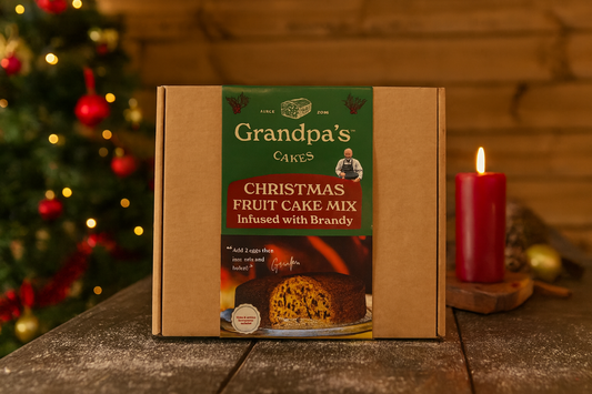 Christmas Fruit Cake mix, make your own christmas cake on a table with a candle.