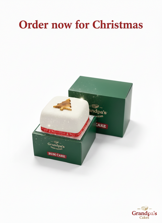 Order your christmas cake now for delivery at Christmas, image shows 4" rum cake on the printed Christmas box.