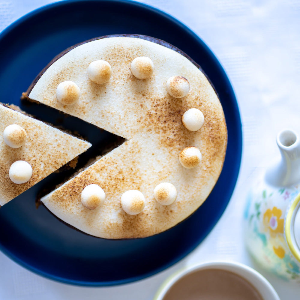 Handmade Simnel cake for Easter with marzipan topping
Traditional British Simnel cake with eleven marzipan balls
Simnel cake slice showing baked marzipan layer
Easter Simnel fruit cake alcohol free with mixed spice